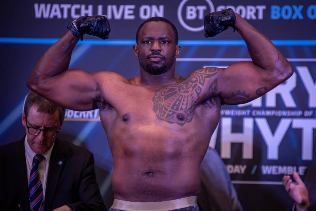April 22, 2022, London, London, England, UK: LONDON, ENGLAND - APRIL 22: Boxer Dillian Whyte poses on the scale during the official weigh-in for his bout against Tyson Fury at the Boxepark on April 22, 2022, in London, England, UK. He has been pulled from his schedule bout with Anthony Joshua.