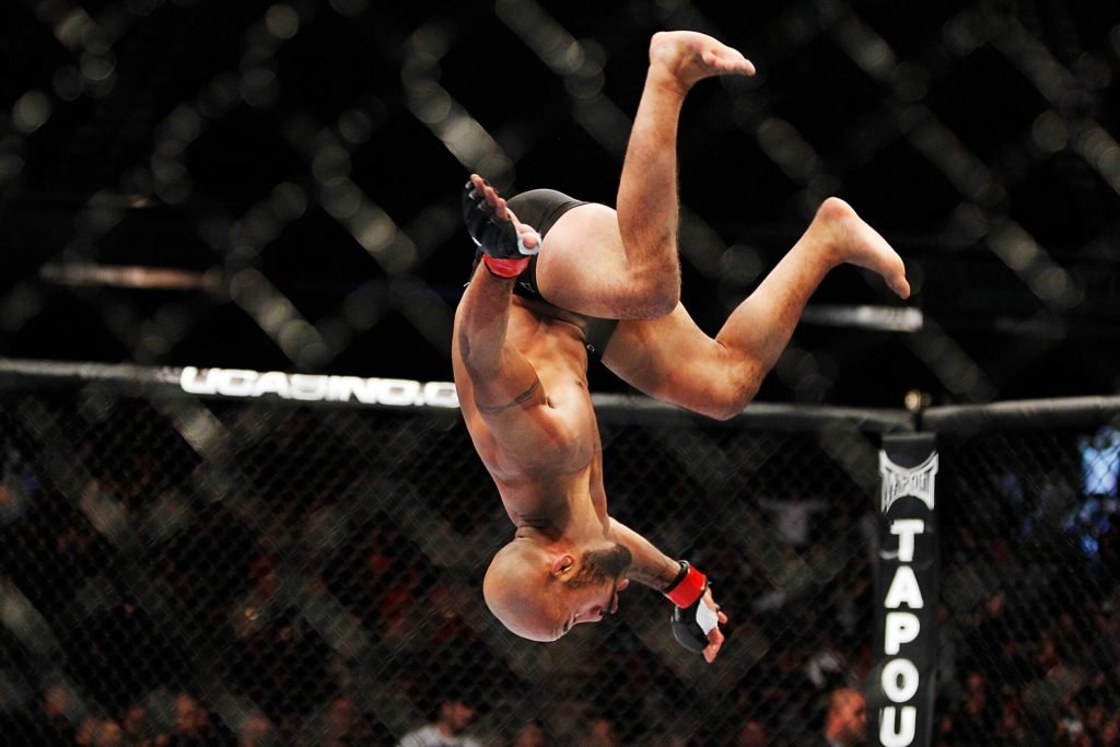 Long time UFC champion Demetrious Johnson does a backflip. He will also compete in BJJ soon.