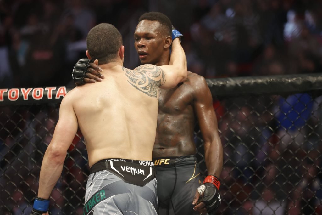 MMA: UFC 271-Adesanya vs Whittaker, Feb 12, 2022; Houston, Texas, UNITED STATES; Israel Adesanya (red gloves) and Robert Whittaker (blue gloves) react after their during UFC 271 at Toyota Center. Mandatory Credit: Troy Taormina-USA TODAY Sports, 12.02.2022 23:51:28, 17676696, NPStrans, Israel Adesanya, TopPic, Toyota Center, MMA, Robert Whittaker PUBLICATIONxINxGERxSUIxAUTxONLY Copyright: xTroyxTaorminax 17676696